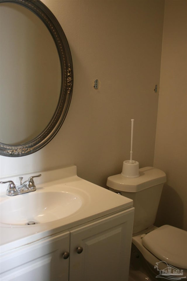 bathroom featuring vanity and toilet