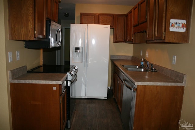 kitchen featuring sink, white fridge with ice dispenser, black range with electric cooktop, stainless steel dishwasher, and dark hardwood / wood-style floors