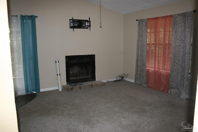 unfurnished living room featuring a fireplace and carpet floors