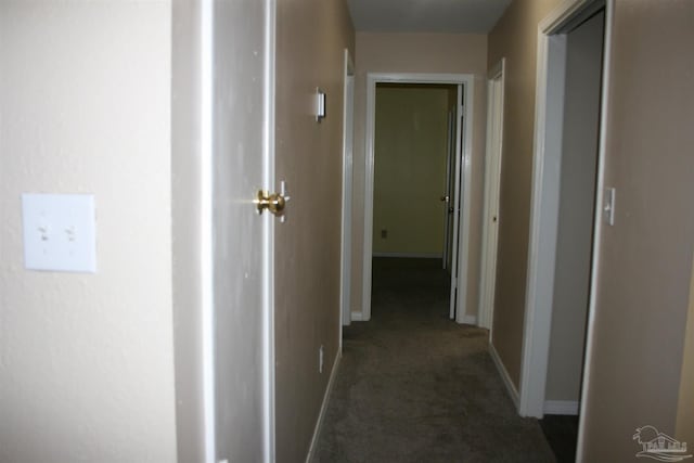 corridor with dark carpet