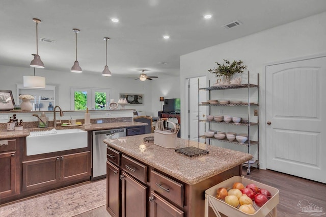 kitchen featuring a sink, visible vents, ceiling fan, and dishwasher