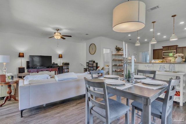 dining area featuring recessed lighting, visible vents, a ceiling fan, and wood finished floors