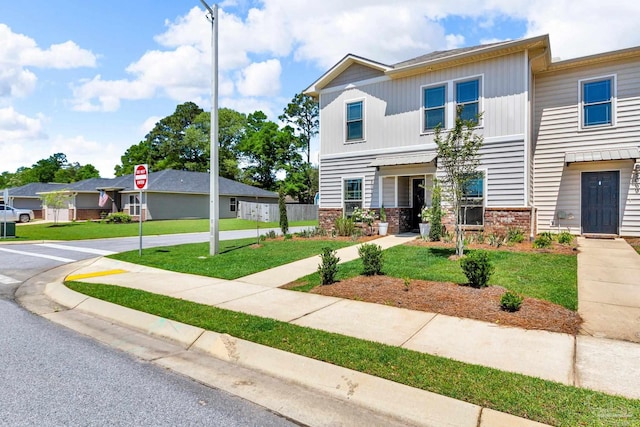 view of front facade with a front lawn
