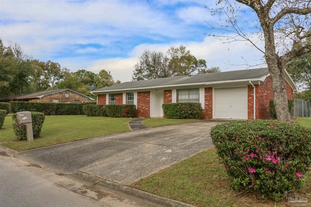 single story home featuring a garage and a front yard