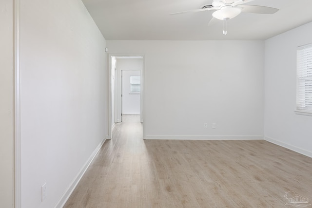 spare room featuring light hardwood / wood-style flooring and ceiling fan