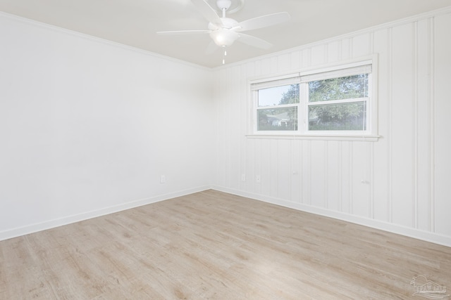 spare room with light wood-type flooring, ceiling fan, and crown molding