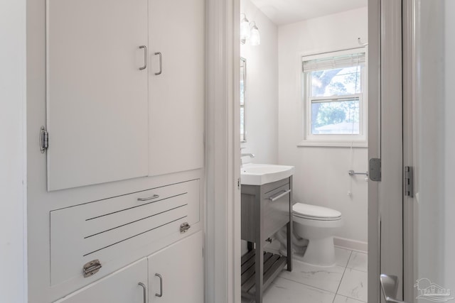 bathroom featuring toilet and vanity