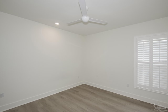 spare room with hardwood / wood-style flooring