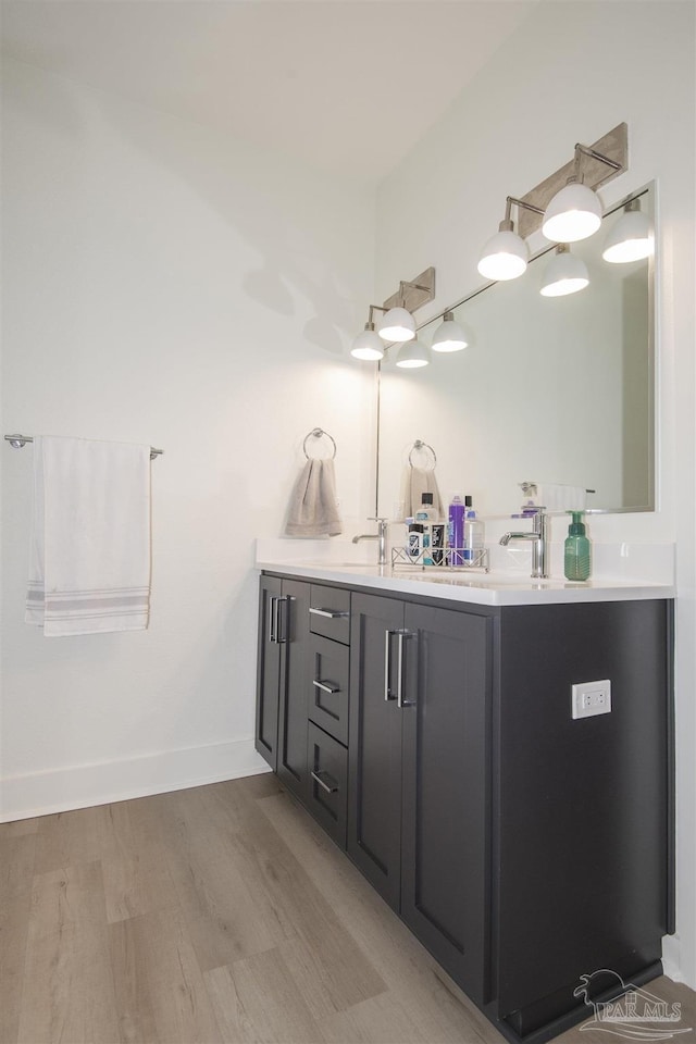 bathroom featuring hardwood / wood-style floors and vanity