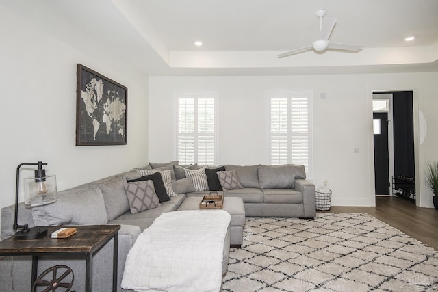 living room with hardwood / wood-style flooring and ceiling fan