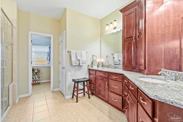 bathroom featuring vanity, tile patterned floors, and an enclosed shower