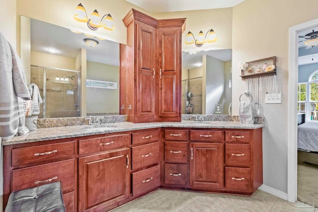 bathroom with tile patterned flooring, vanity, and an enclosed shower