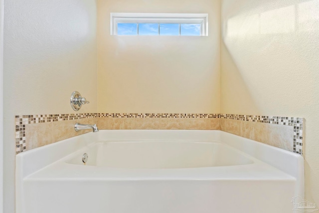 bathroom with a tub