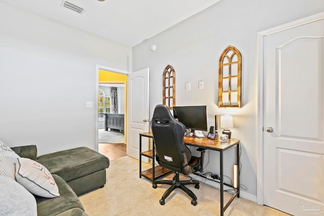 office space with light hardwood / wood-style floors