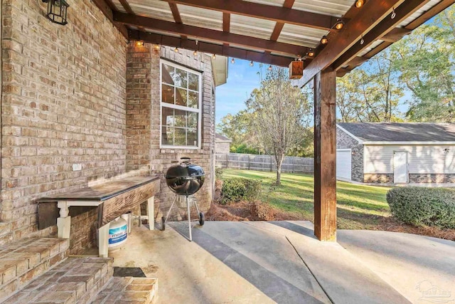 view of patio featuring area for grilling and an outdoor structure