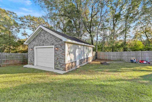 garage featuring a lawn