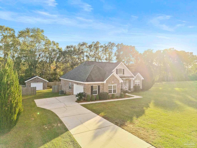 view of front of house with central air condition unit, a front yard, and a garage