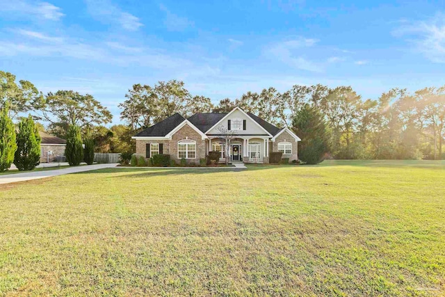 view of front of house featuring a porch and a front yard