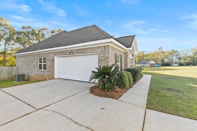 view of home's exterior featuring central AC, a garage, and a lawn