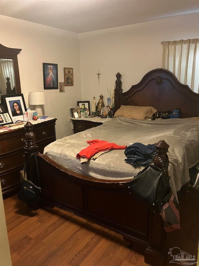 bedroom featuring hardwood / wood-style floors