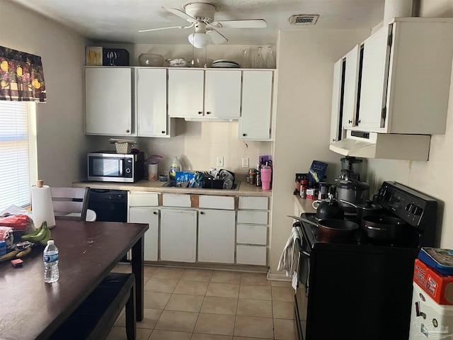 kitchen with white cabinets, light tile patterned floors, black appliances, ceiling fan, and sink