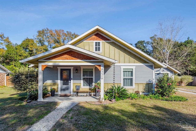 bungalow-style house featuring a front yard and a porch