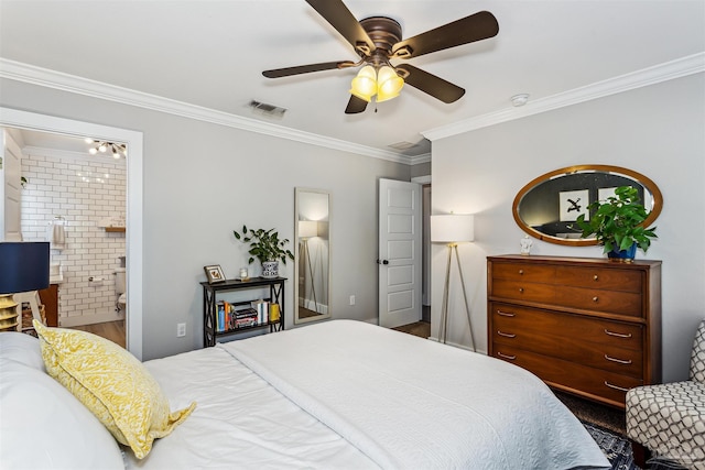 bedroom featuring ceiling fan, ensuite bathroom, and crown molding