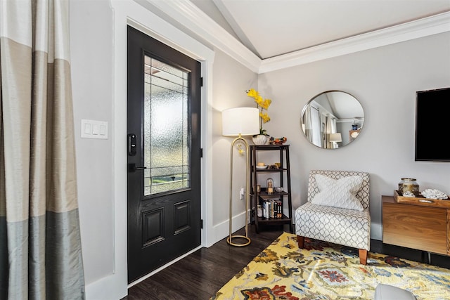 foyer with crown molding, dark hardwood / wood-style flooring, and lofted ceiling