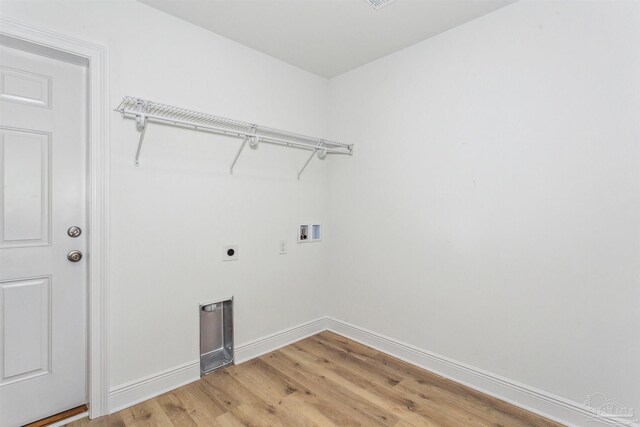 washroom with laundry area, hookup for a washing machine, baseboards, electric dryer hookup, and light wood-style flooring