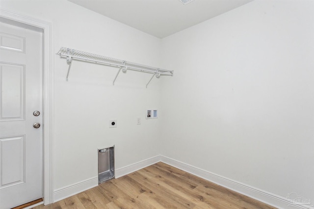 9319 Salter Rd, Pace, FL 32571 - washroom with laundry area, hookup for a washing machine, light wood-style flooring, baseboards, and hookup for an electric dryer