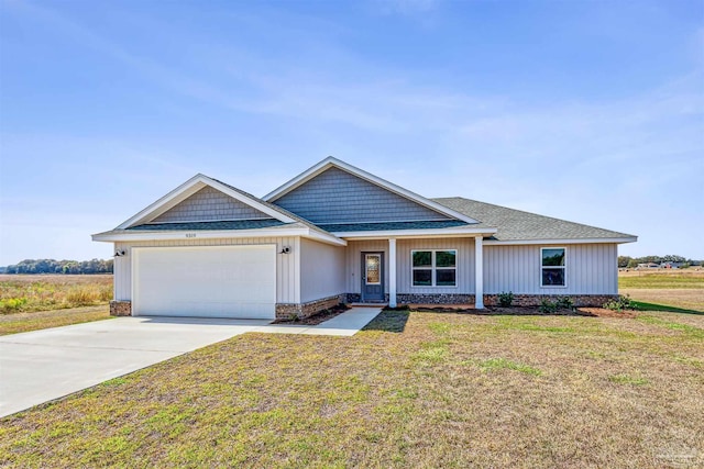 ranch-style house featuring concrete driveway, a front yard, and a garage
