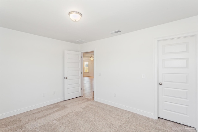 9319 Salter Rd, Pace, FL 32571 - unfurnished room with baseboards, visible vents, and light carpet
