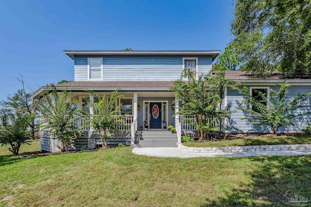 view of front facade with a front lawn and a porch