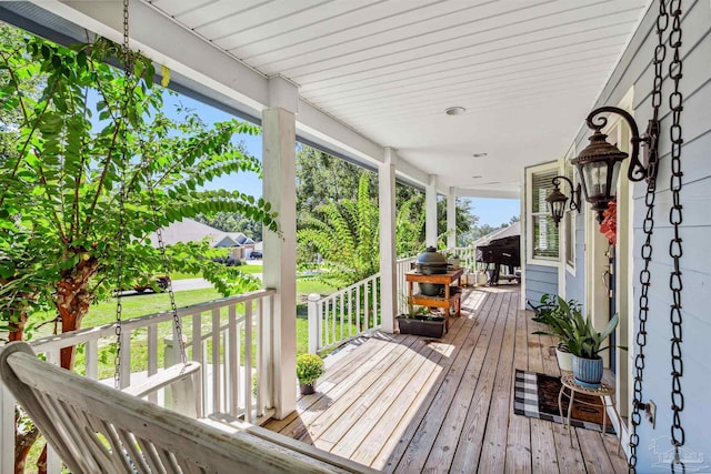 wooden deck featuring covered porch