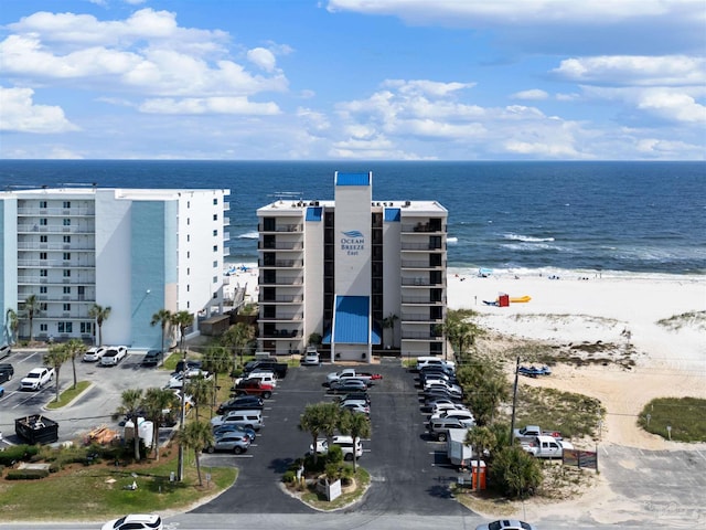 bird's eye view with a water view and a view of the beach