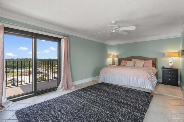 bedroom featuring ornamental molding, access to exterior, and a textured ceiling