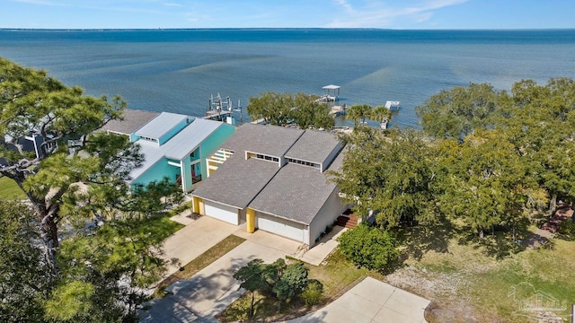 birds eye view of property with a water view