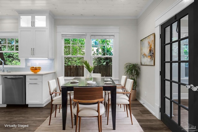 dining space featuring dark hardwood / wood-style floors and wooden ceiling