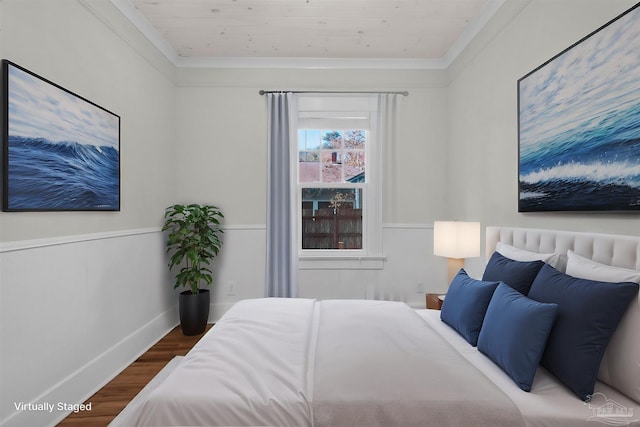 bedroom with crown molding, hardwood / wood-style floors, and wood ceiling