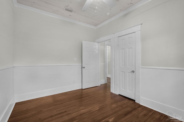 empty room featuring crown molding, ceiling fan, wood ceiling, and dark hardwood / wood-style floors