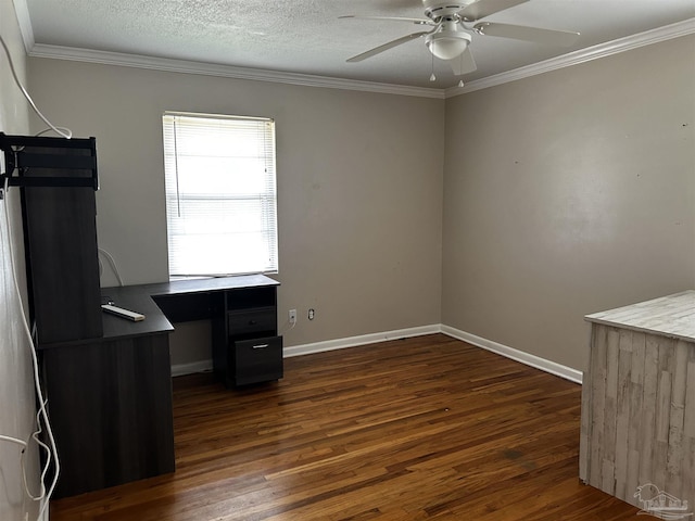 unfurnished office with a textured ceiling, a ceiling fan, baseboards, dark wood finished floors, and crown molding