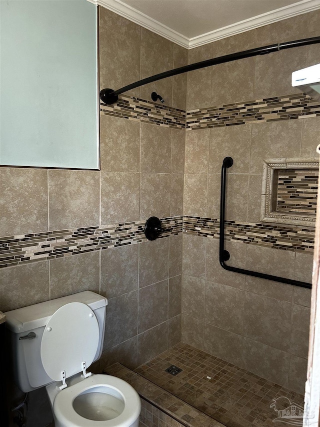 bathroom with toilet, a stall shower, and ornamental molding