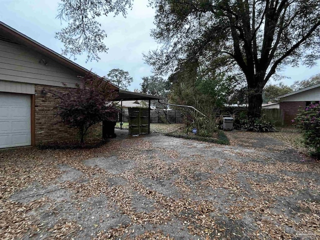 view of gate with fence