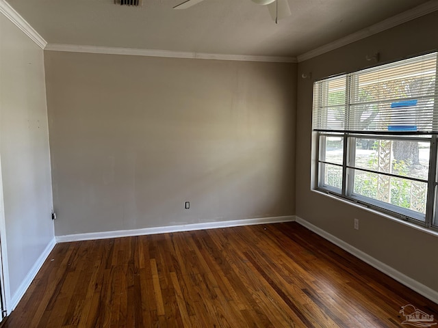 empty room featuring ceiling fan, baseboards, ornamental molding, and dark wood finished floors