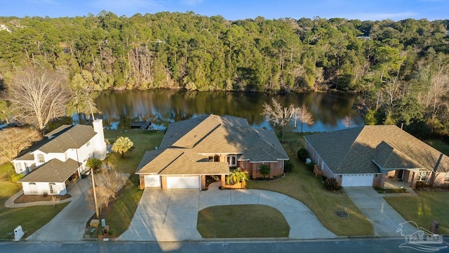 aerial view featuring a water view and a view of trees