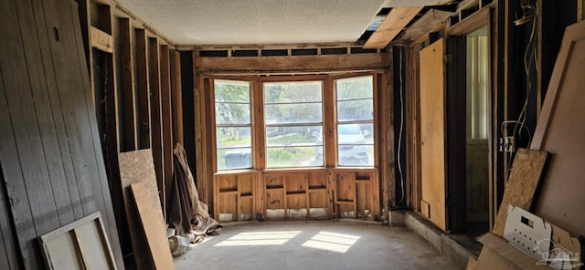 unfurnished room featuring a textured ceiling