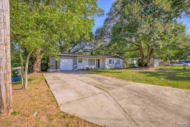 single story home with a front yard and a garage