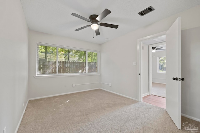 unfurnished room with light carpet