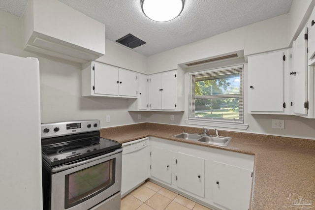 kitchen featuring white appliances, sink, a textured ceiling, and white cabinetry