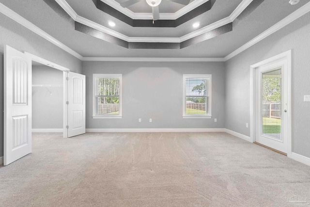 591 Nowak Rd, Cantonment, FL 32533 - carpeted spare room featuring ornamental molding, a raised ceiling, plenty of natural light, a ceiling fan, and baseboards